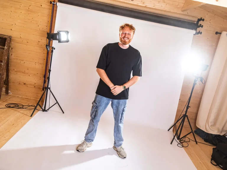 Dan Dennis standing in front of a white background